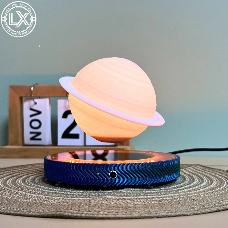 Floating Saturn lamp on a desk with the base switch in front