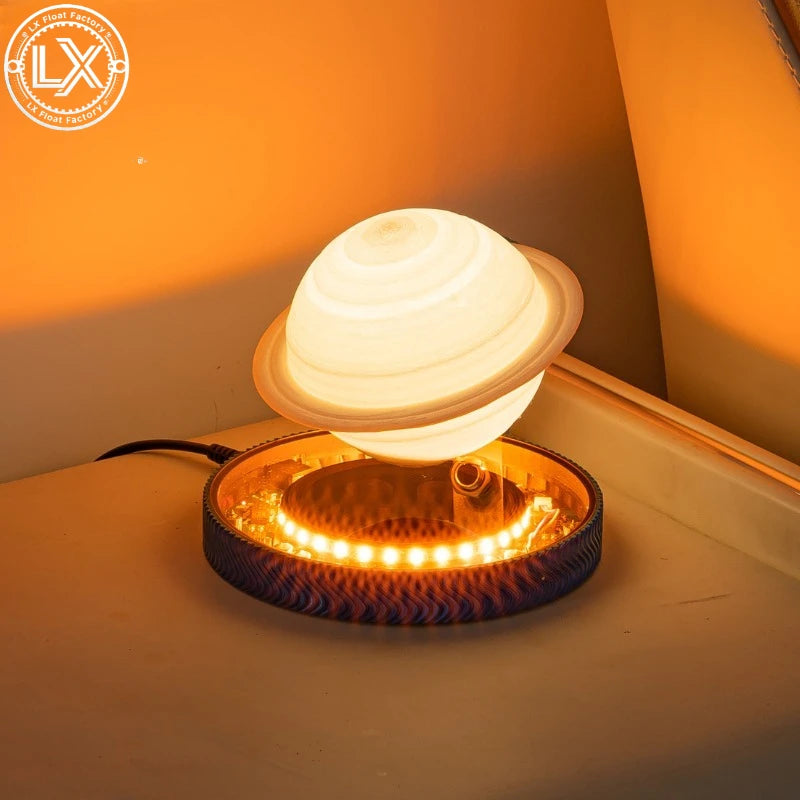 Floating Saturn night light glowing warm on a nightstand