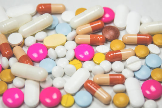 Assorted unbranded dietary supplement capsules and tablets